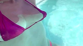 Artemisia Love dressed in a wondrous bathing suit in the outdoor jacuzzi