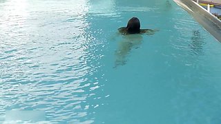Beautiful Redhead's Playful Charm by the Poolside