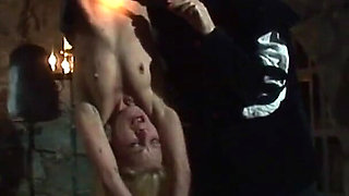 Witch Hangs Upside Down and Gets Drizzled with Black Wax