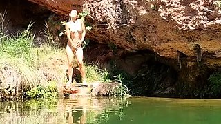 Wild girl posing naked and playing with herself outdoors