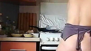 A Sexy Naked Woman Prepares Food in the Kitchen