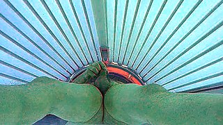 Masturbating in public tanning bed