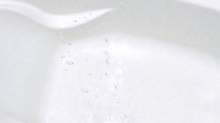 Soaking the bathtub with pee