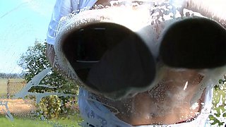 Blonde is flashing her big boobs in the outdoors