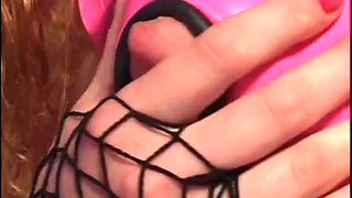 Curly haired redhead slut wearing latex and fishnets gets her ass fucked