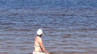 Nimble Mature Stepmommy Has Fun with Young Guys on the Beach 2