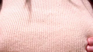 Sensuous brunette with big tits plays with her nipples