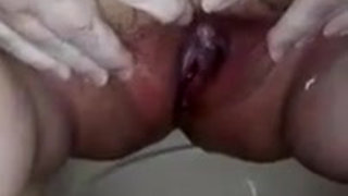 Closeup of Jen pissing in the porta potti