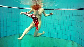 Kinky underwater stripping show performed by lovely amateur gal