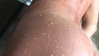 Bodacious brunette beauty posing naked in the shower