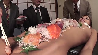 Group Of Business Men Eat Sushi Off Her Beautiful Body