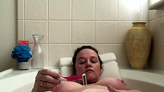 Attractive brunette teenager with big boobs fingering pussy