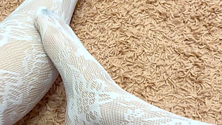 Rubbing my slim legs in hot stocking and heels