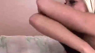 Playing with blue toy on the couch