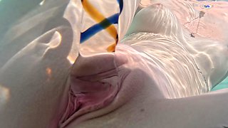 Blond bombshell Luana indulges in a steamy poolside orgasm fest with her favorite waterproof toy