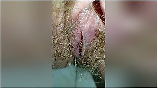 Bushy Pussy Girl Peeing In The Toilet With A Sanitary Pad In Her Panties