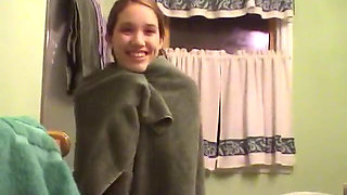 Cute brunette teen soaps up in the shower and takes time to trim her bush