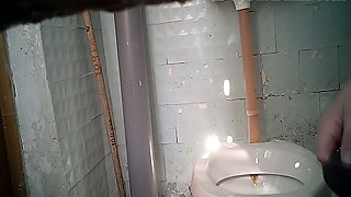 Chunky white milf lady in the public toilet room pisses on hidden cam