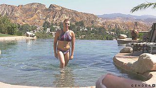 Cassie Woods fucks a man by the pool and that shemale is quite passionate